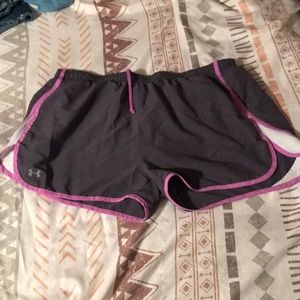 Grey and purple under armor shorts.